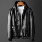 Black leather jacket on a hanger against a gray background