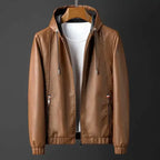 Brown leather jacket on a mannequin against a dark background