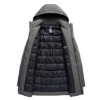 A hooded puffer coat shown open against a plain white background, with a dark gray exterior and a black quilted interior lining.