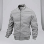 Gray bomber jacket on a white background