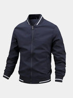 Navy blue jacket with white trim on a light gray background