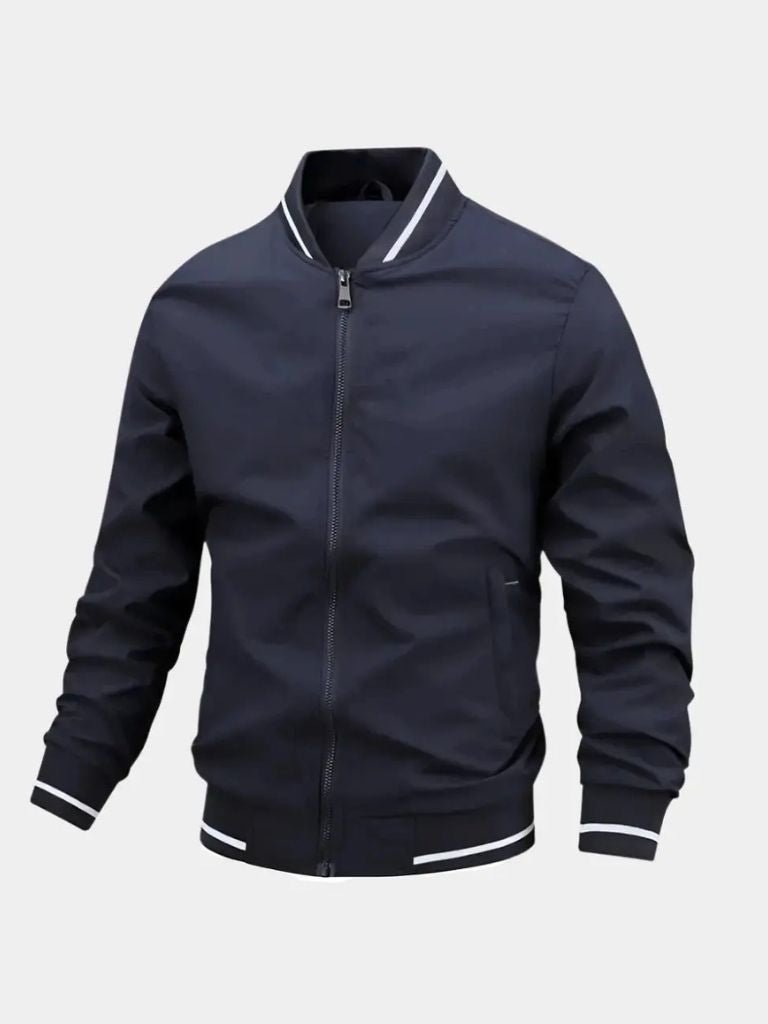 Navy blue jacket with white trim on a light gray background