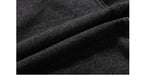 Close-up of dark denim fabric with visible texture