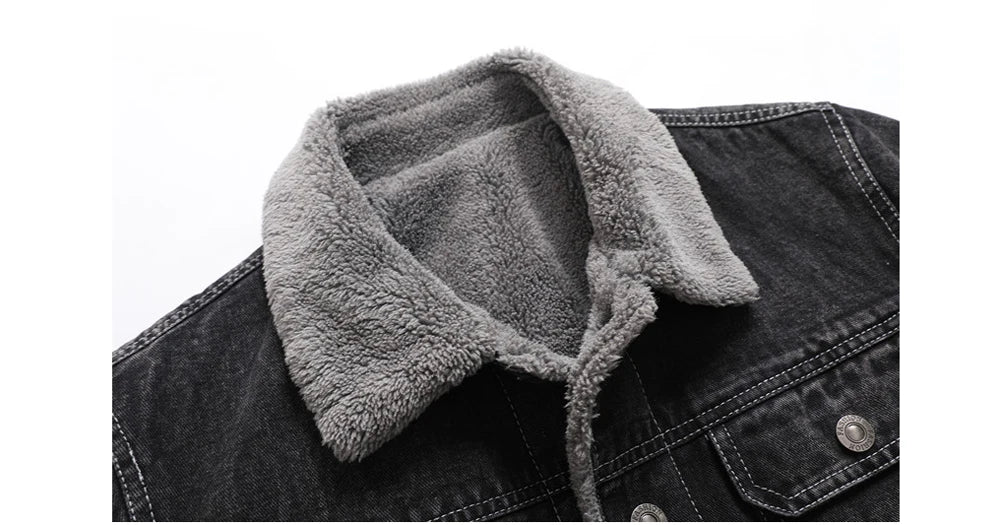 Black denim jacket with gray fleece collar on a white background