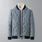 Light blue quilted jacket with black accents on a gray background