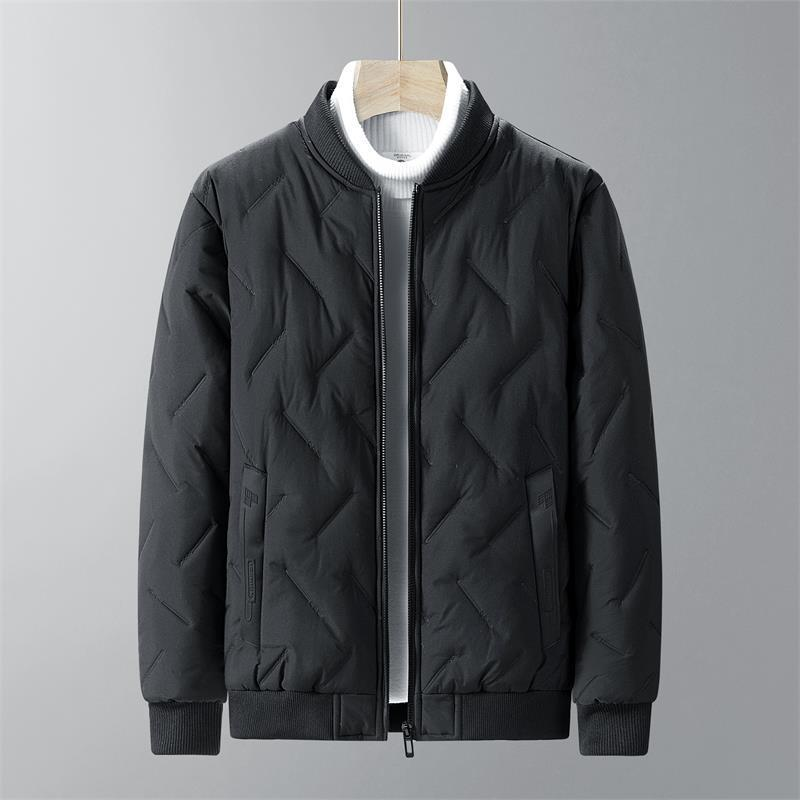 Black quilted jacket on a hanger against a gray background