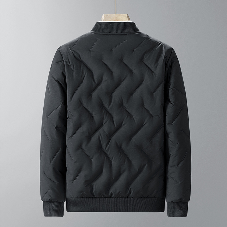Black quilted jacket on a gray background