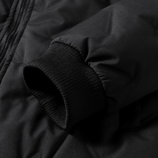 Close-up of a black jacket with a focus on the sleeve and fabric texture.