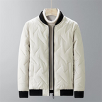 White quilted jacket with black accents on a gray background