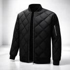Black quilted jacket on a white background