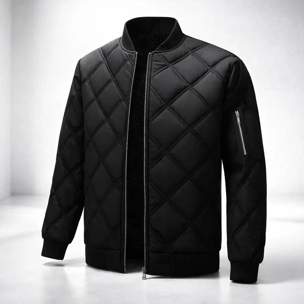 Black quilted jacket on a white background
