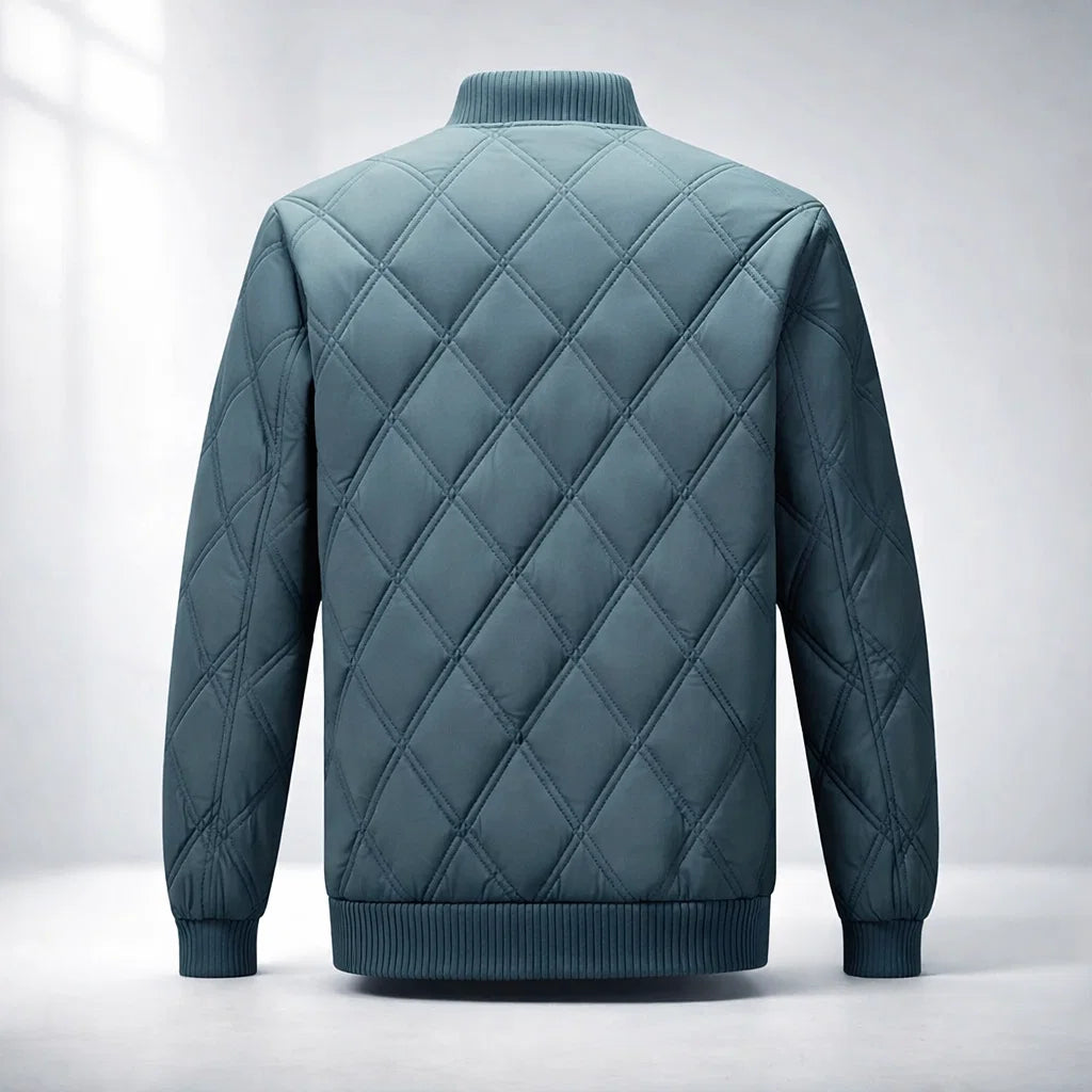 Quilted jacket with diamond pattern on a light gray background
