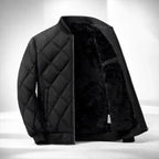 Black quilted jacket with shearling lining on a white background