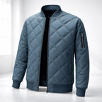 Blue quilted jacket on a white background