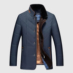 Blue quilted jacket with plaid lining on a light gray background