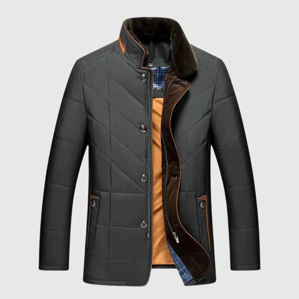 Gray quilted jacket with brown lining on a light gray background