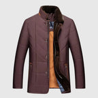 Purple quilted jacket with brown collar on a light gray background