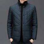 Dark blue quilted jacket on a gray background