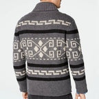 Gray sweater with a pattern on the back against a light gray background