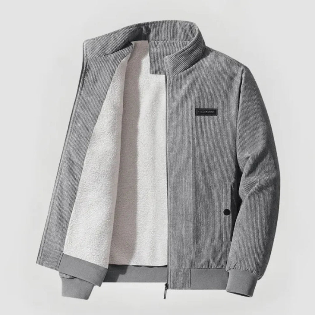 Gray corduroy jacket with a white shirt underneath on a light gray background