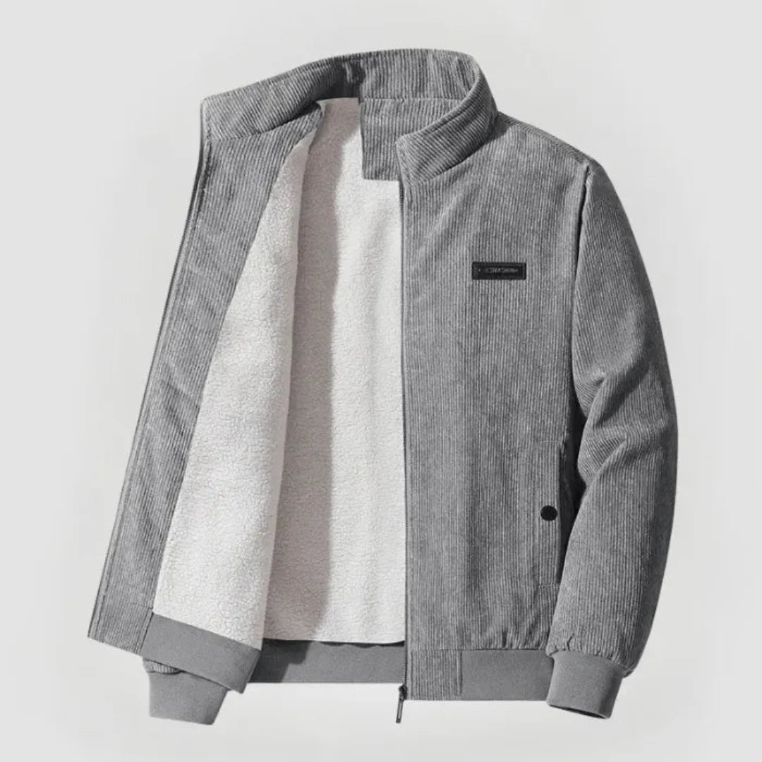 Gray corduroy jacket with a white shirt underneath on a light gray background