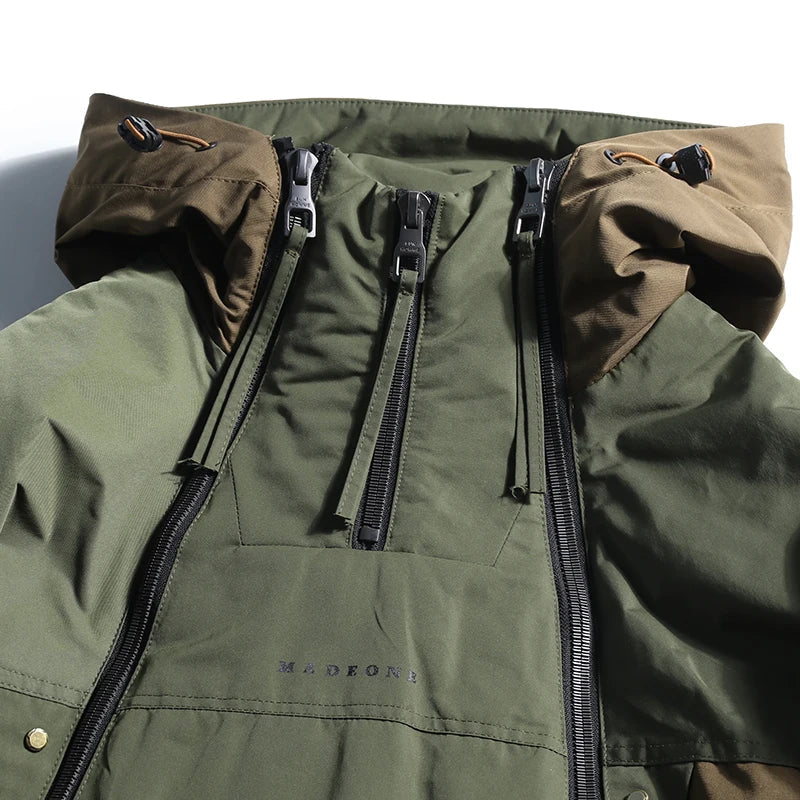 Green jacket with brown hood and zippers on a white background