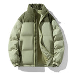 Green puffer jacket on a white background