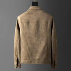 Brown leather jacket on a mannequin against a gray background