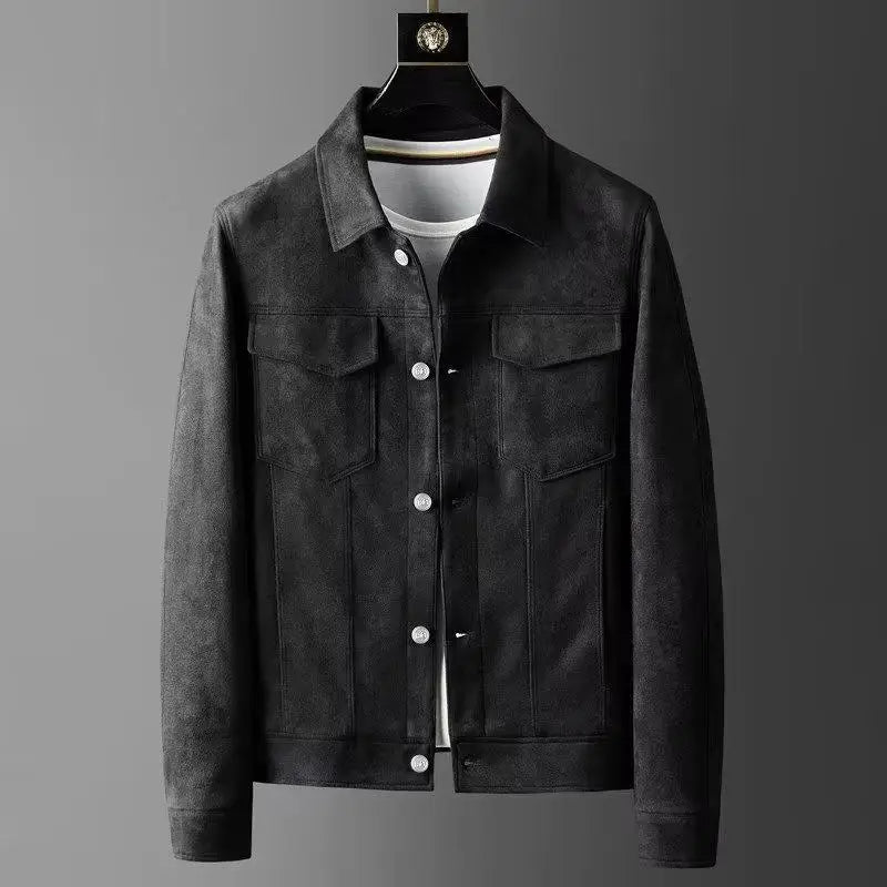 A men's dark gray suede or micro-suede jacket with a classic collar, button-up front, and flap chest pockets, displayed on a hanger over a white t-shirt against a dark gray gradient background.