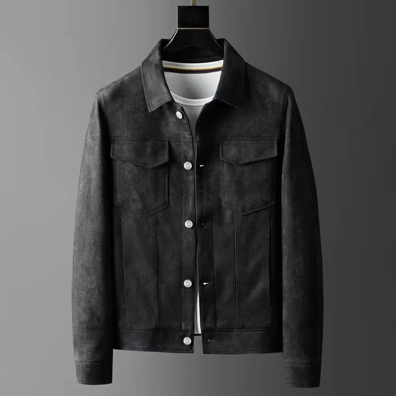 A men's dark gray suede or faux-suede jacket displayed on a black hanger over a white t-shirt, set against a dark gray gradient background.
