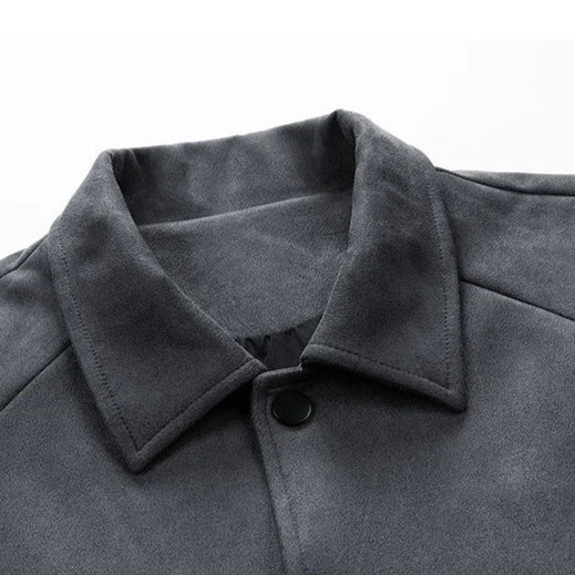 Close-up of a gray coat collar with a button on a white background