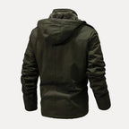 Green jacket with fur-lined hood on a white background