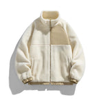 Cream-colored fleece jacket with a contrasting panel on a white background