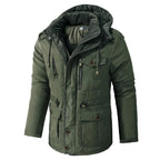 Green winter jacket with a hood on a light gray background