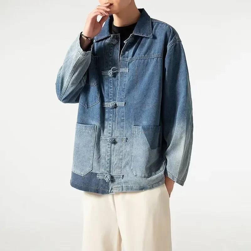 Person wearing a blue denim jacket on a white background