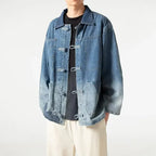 Person wearing a blue denim jacket on a white background