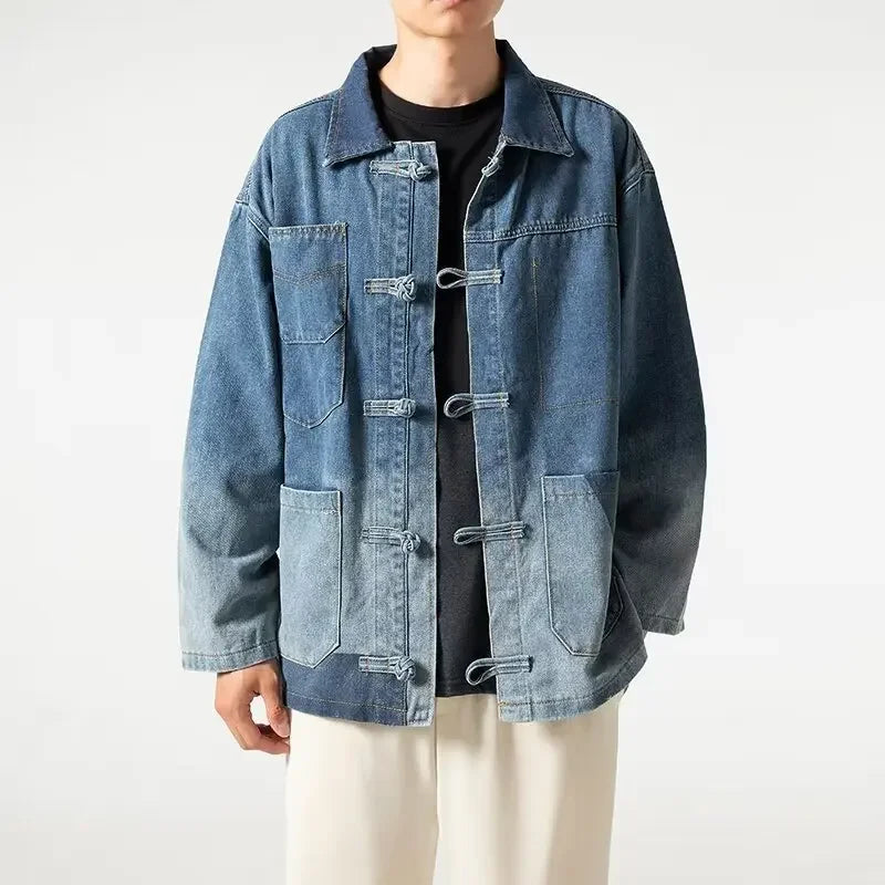 Person wearing a blue denim jacket on a white background