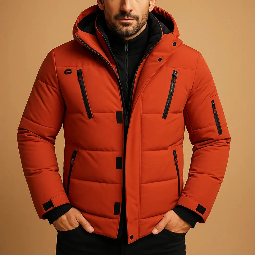 Man wearing a red puffer jacket on a beige background