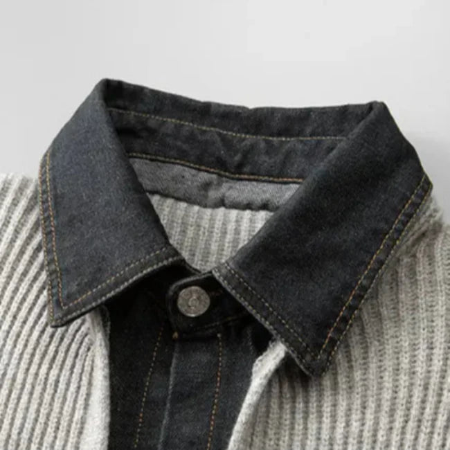 Close-up of a denim collar on a gray sweater with a white background