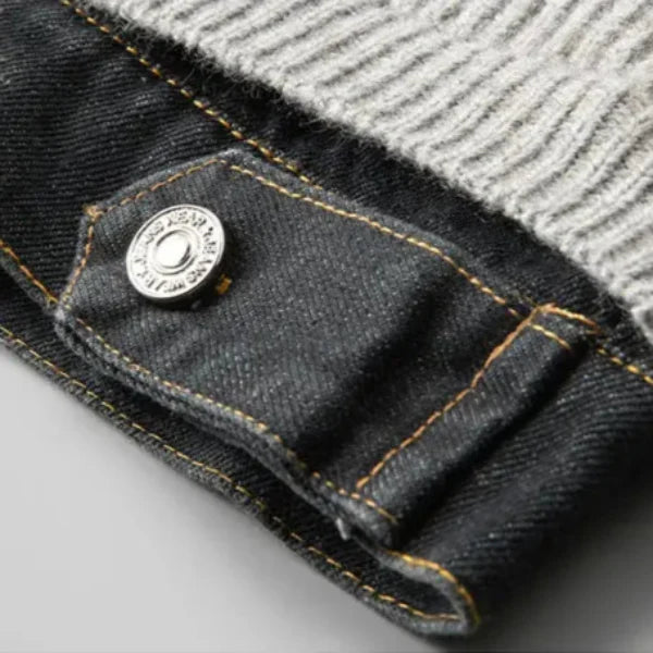 Close-up of a button on a denim jacket with a gray background