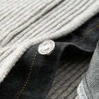 Close-up of a button on a piece of fabric with a textured background