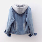 Blue denim jacket with a gray hoodie on a white background