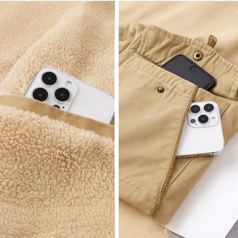 Phone in a pocket of beige fleece and pants