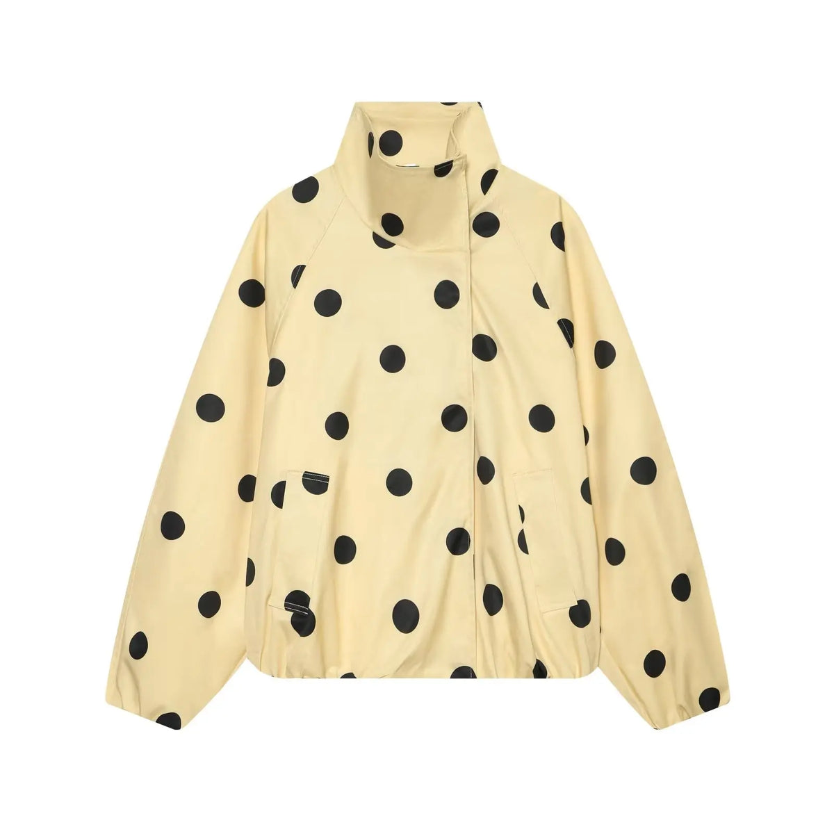A cream-colored lightweight jacket with a black polka dot pattern, featuring a stand-up collar and front zipper closure, shown against a plain white background.