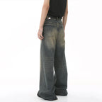 Person wearing a pair of wide-leg jeans on a white background