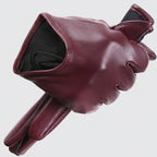 Maroon leather glove with brand logo on a white background