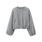 Gray sweater with balloon sleeves on a white background