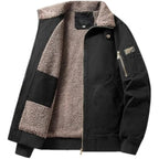 Black jacket with brown sherpa lining on a light gray background