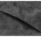Close-up of a dark gray suede or microfiber fabric texture with a folded corner showing the material's soft, mottled surface.