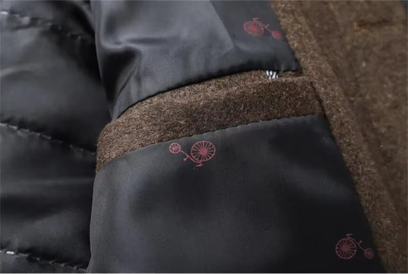 Close-up of a black jacket with brown lining and red floral patterns.